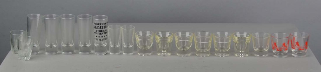 Lot of 18: Shot Glasses: Various styles and sizes. Condition (Excellent). Size Tallest is 4" T.