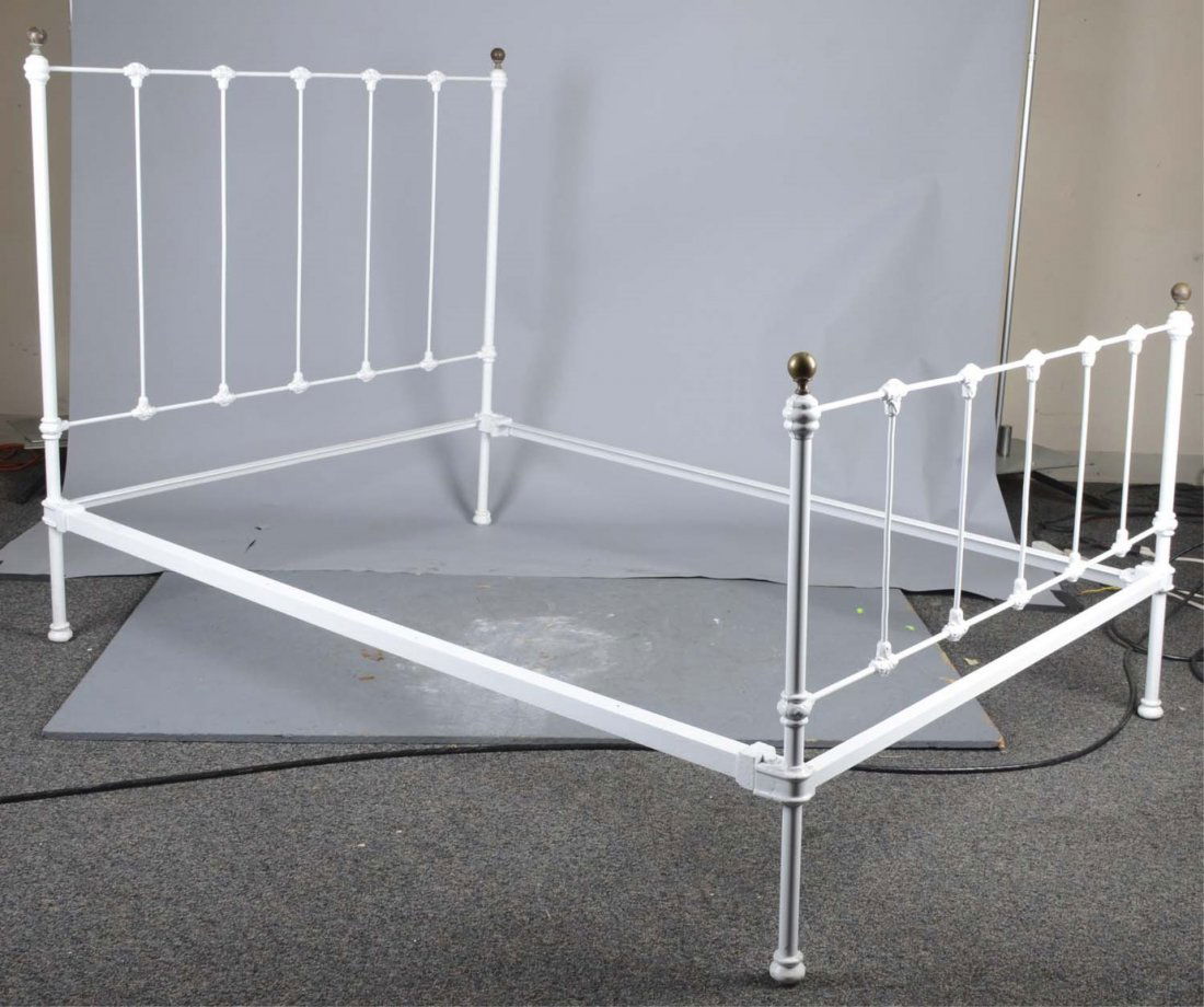 Iron Rail Bed With Brass Ball Accents & Side Rails: White painted iron bed frame with one brass ball on each corner of the headboard and footboard. Includes two side rails (one is 3/4 longer then the other). Condition (Very Good). Size 53" x 78" x 52"
