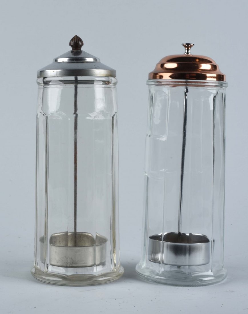 Lot Of 2: Straw Jars.: This lot includes a jar with a chrome lid and a jar with a copper lid. Very clean pair. Condition (Excellent). Size Largest : 11 -1/4" T.