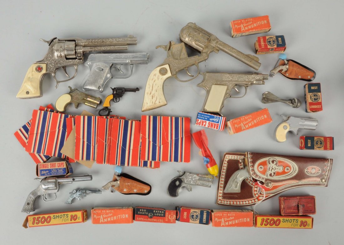Lot of Cap Guns & Caps.: Includes numerous cap guns in lesser condition and numerous boxes of caps. Condition (Good). Size Largest : 7 -1/4" L.