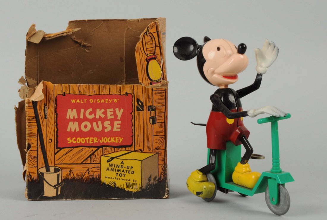 Walt Disney Wind-Up Scooter Jockey Toy With Box.: The original box has heavy tears and paper loss. The toy has some staining on the right foot. Condition (Very Good- Excellent). Size 6'' T.