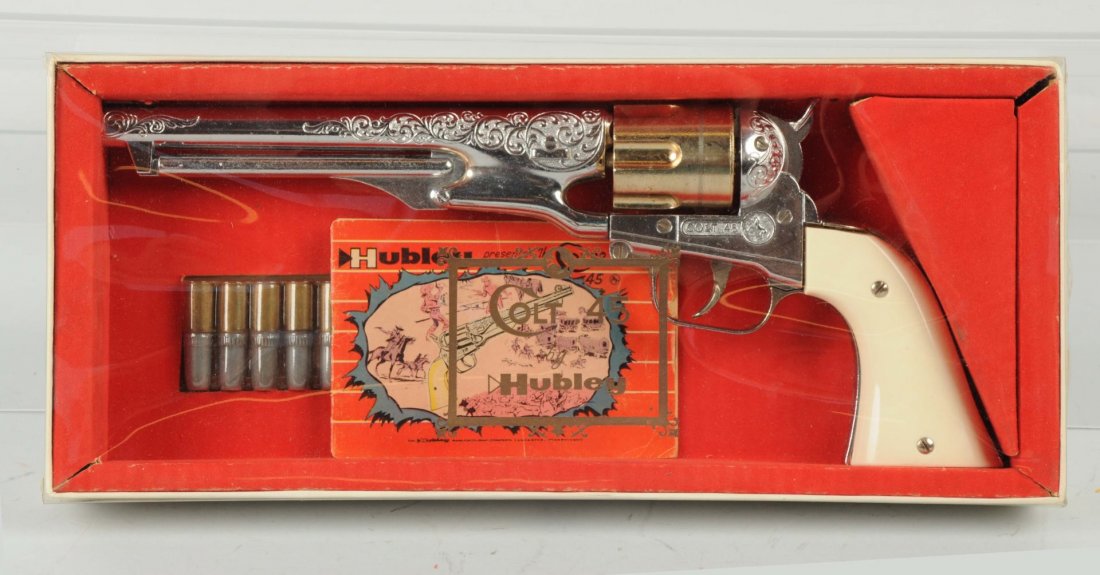 Hubley Boxed Colt .45 Toy Gun.: This piece appears to be new in the box with the gun exhibiting no wear. The pamphlet has some handling wear and a few fold lines. Condition (Near Mint). Size Box: 14-1/2'' x 6-1/2'' x 2''.