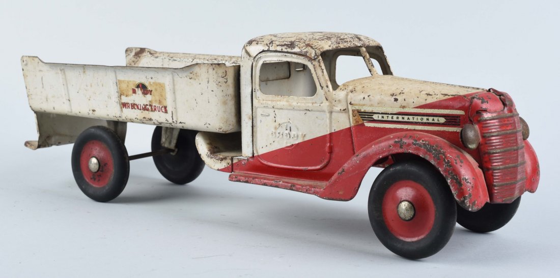 Buddy L. Pressed Steel Wrecking Truck.: This Buddy L. International wrecking truck has moderate paint loss and damage. Condition (Very Good). Size 22'' L.