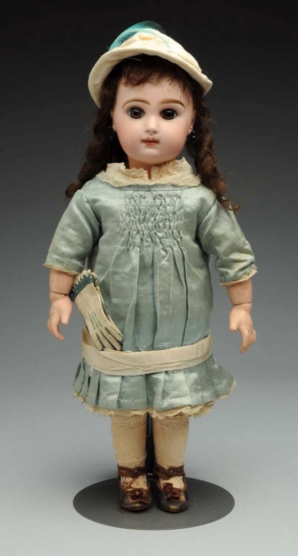 Dramatic Jumeau Bébé Doll.: French bisque socket head with red stamp “Depose Tete Jumeau Bte SGDG 7” with Jumeau checkmarks (speckling overall, nose rub), multistroked eyebrows, brown paperweight eyes with amber threading, p