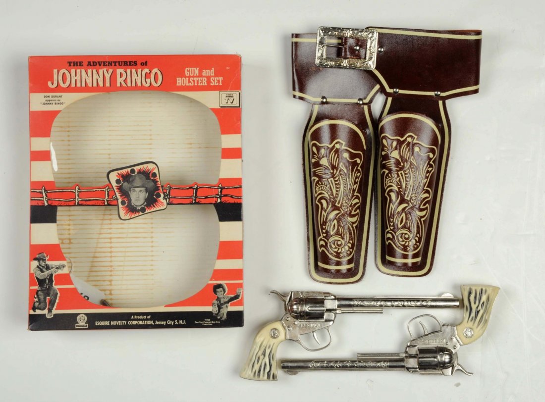 Johnny Ringo Gun & Holster Set In Box.: Guns are marked special. The one Ballet holder has cracked in half and fell off the holster. The pieces are here but not repairable. (Guns: Excellent - Holster: Very Good - Excellent - Box: Excellent)