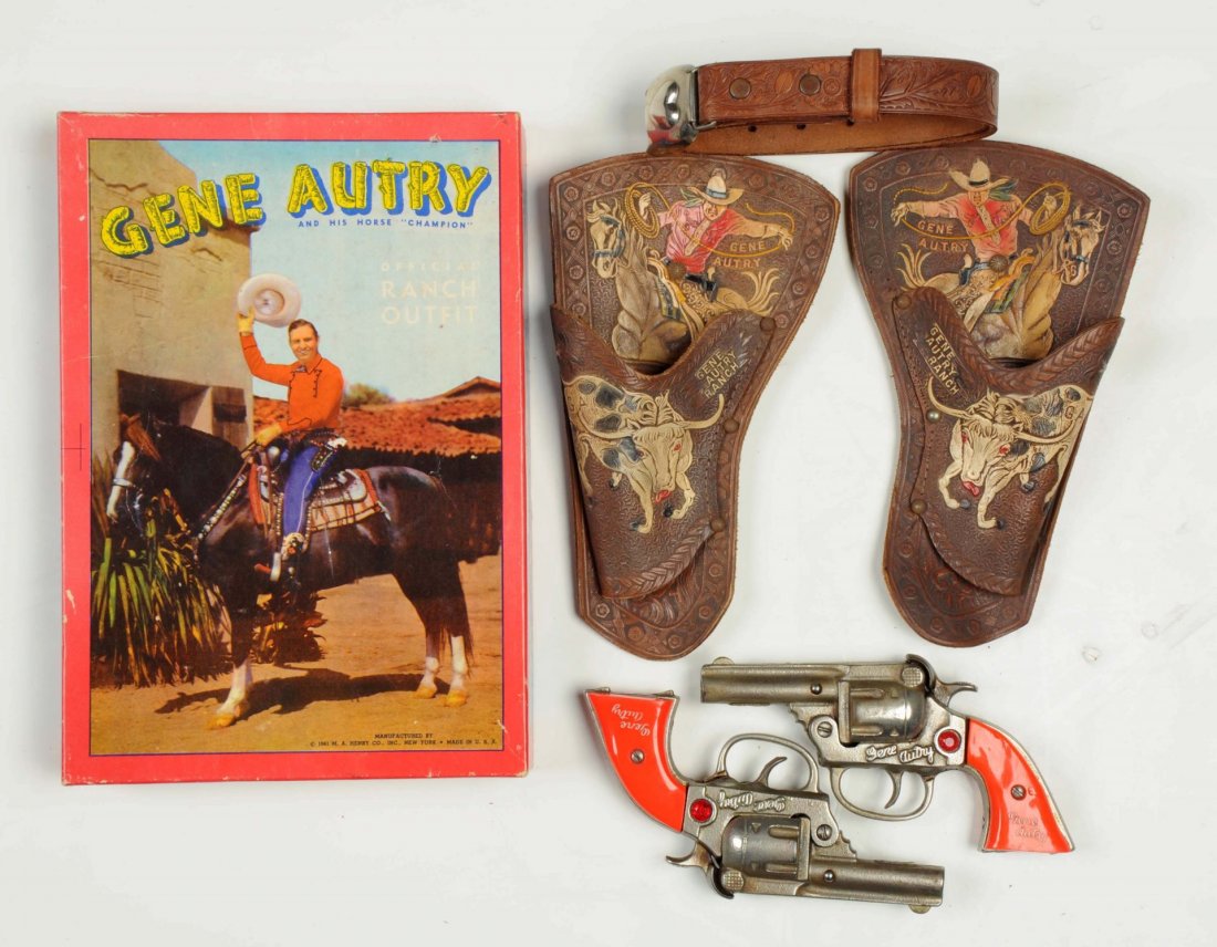 Gene Autry Gun & Holster Set In Box.: One gun not firing and is missing one jewel, also a warped grip. Other gun is very good - excellent. Both have fired a lot of caps. Holster has some rusty studs. The holsters are very hard to find in