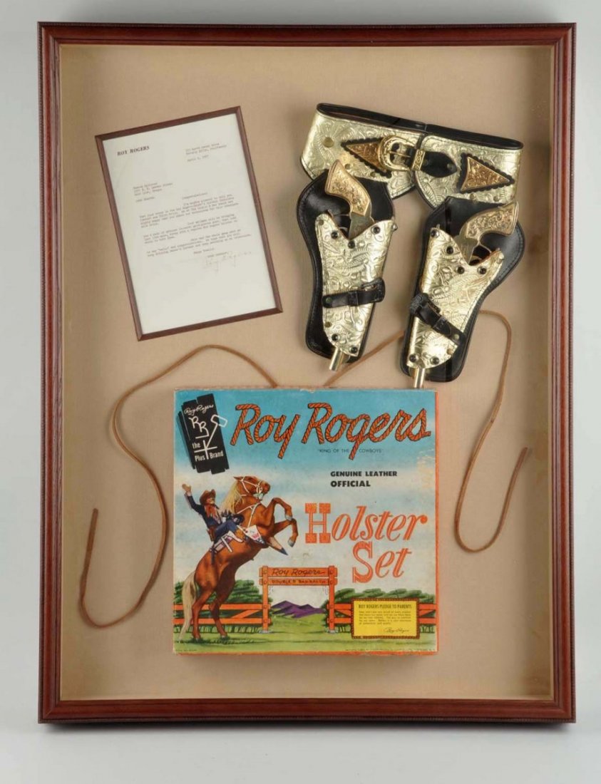 Roy Rogers Bakers Chocolate Gun & Holster.: 14K Gold plated classy prods guns. Baker Chocolate prize signed letter framed. Very hard to find. Condition (Near Mint). Size Display: 34 - 1/2" x 26 - 1/2".