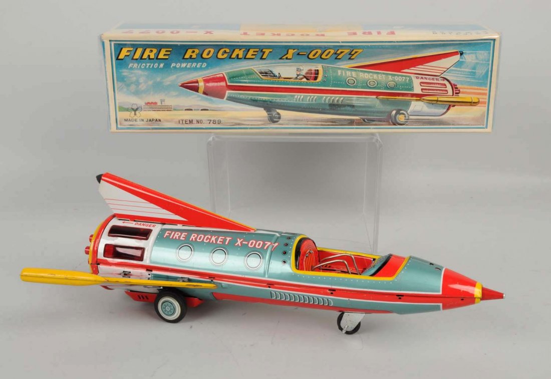 Japanese Tin Litho Friction X-0077 Fire Rocket. (1 of 2)