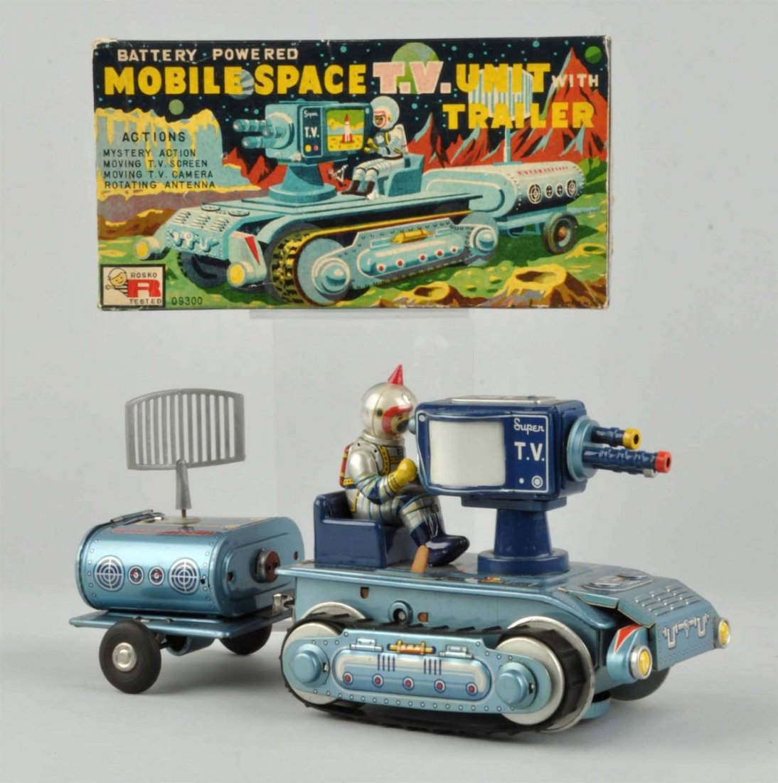 Jap. Tin Litho Mobile Space TV Unit With Trailer.: Battery - operated. Includes colorful original box marked "Rosko", does have some creasing and a few small poke holes. Two piece unit with original antenna and treads. Made by T.N, Japan. Toy has very