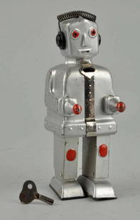 German Tin Litho Wind-Up ST-1 Robot.: Similar to Japanese Mechanical Brain Robot. Missing small plastic chest piece. Needs flint to spark. General rubbing and wear on both sides of arms and litho loss around back pack. Condition (Very Goo