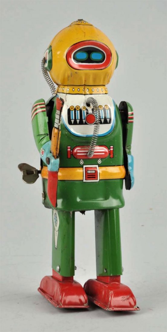 Jap. Tin Litho Friction Interplanetary Robot.: Marked "AN Japan" on rear oxygen tank. Has original gun, all original coiling. Some of the usual factory touch-up on bottom where legs meet body. Some scratching and rubbing throughout. Condition (Ver