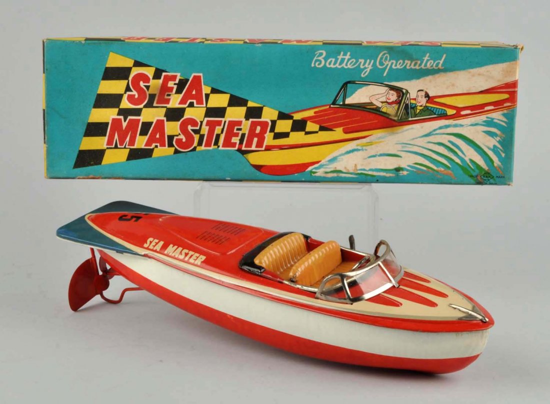 Japanese Battery-Operated Sea Master Boat.: Tin litho. Nice color graphics on box. Made by KKK Japan. Marked "No. 55 Sea Master" on boat. Minor scratching and wear. Some minor staining to box. Condition (Excellent). Size Box: 14 - 3/4" x 4 - 1/
