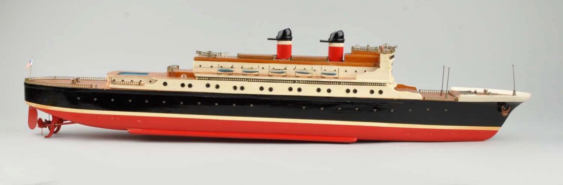 Large Japanese Wooden Battery Operated Ocean Liner: Two stacker. Top super structure is removable. Unusual style. Has ten metal life boats. Some wear. Condition (Very Good - Excellent). Size 35" L.
