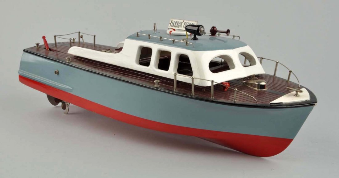Jap. Battery-Operated Wooden Harbor Patrol Boat.: Includes original box, nice color label marked "Made in Japan". Box has inserts and also has original wooden stand. Very little wear. Condition (Near Mint). Size 22" L.
