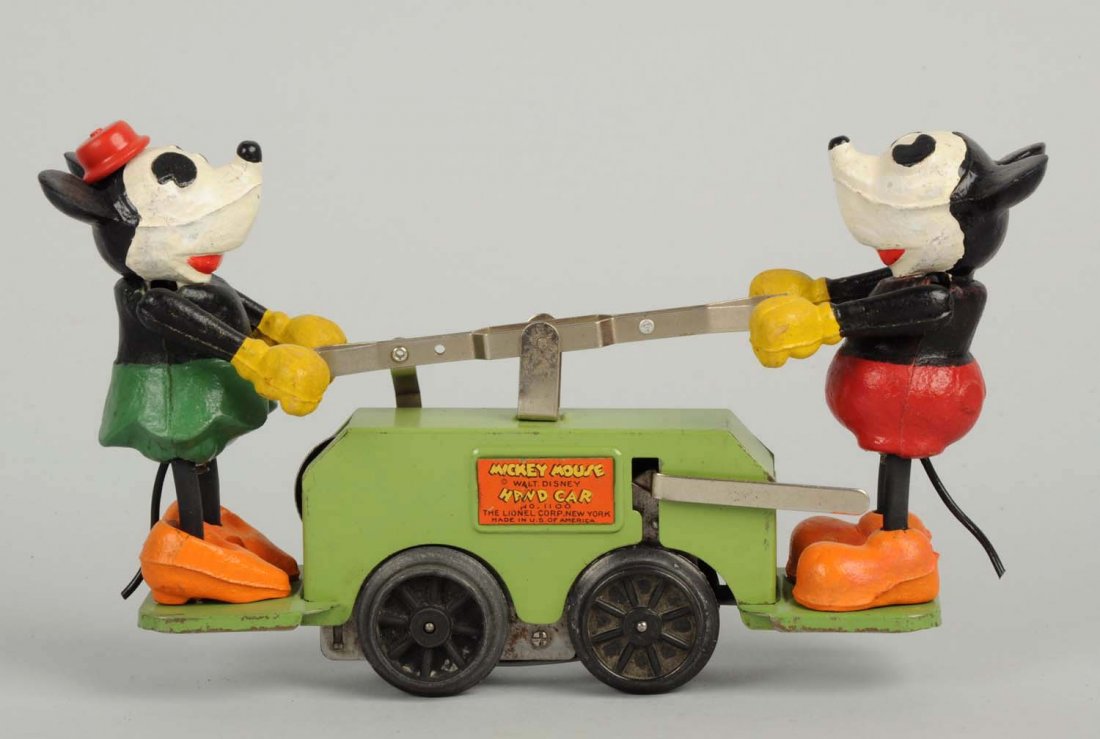 Lionel Walt Disney Mickey & Minnie Hand Car Toy.: Looks to be all original including tails. Scarce green base variation. Some minor paint loss and edge wear around platforms where Mickey and Minnie sit. Otherwise just minor nicks. Condition (Very Goo