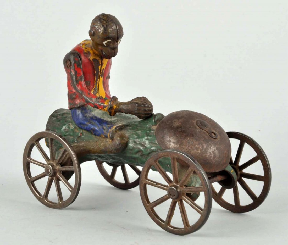 Early Cast Iron Monkey & Coconut Bell Toy. (1 of 3)