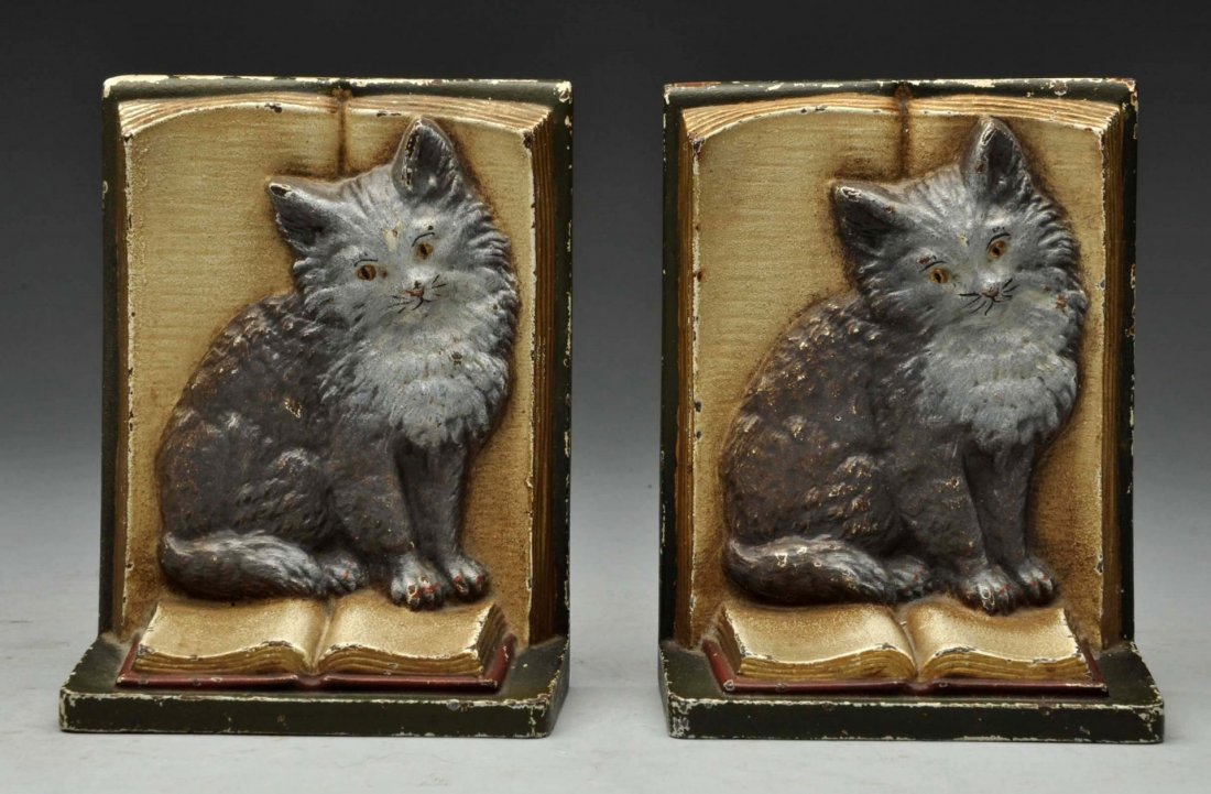 Cast Iron Kitten On Book Bookends.: Made by Bradley and Hubbard, marked “B&H”. Kittens seated on an open book. Matches doorstop. Condition (Excellent). Size 5" T.