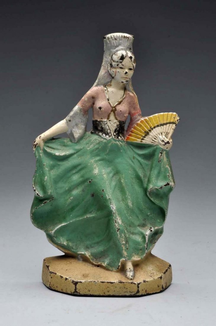 Cast Iron Spanish Lady With Fan Doorstop.: Marked, “L.A.C.S., 760”. Done in pastel colors with Lady holding dress outward. Difficult to find. Condition (Excellent). Size 10'' T.