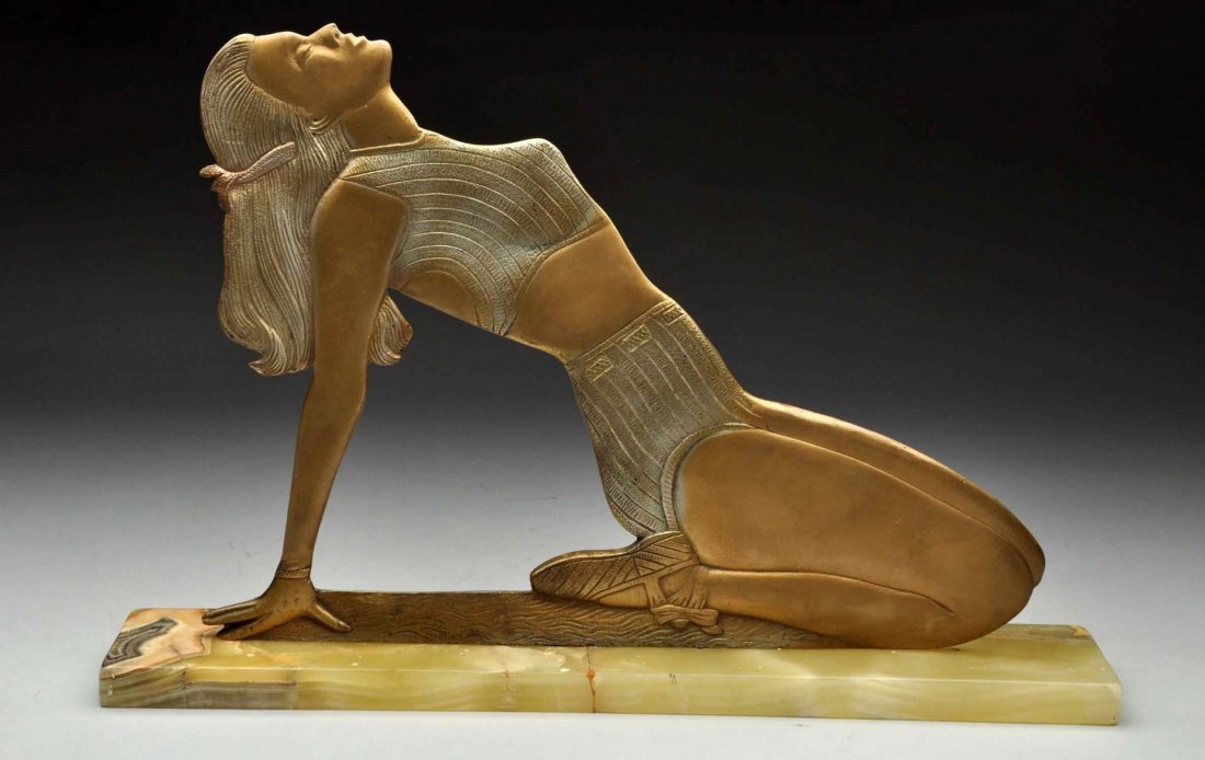 Cast Metal Woman in Swimsuit Figure.: This cast metal figure depicting a woman in a swimsuit is in great condition. Mounted on marble base. Figure is painted gold and silver. Very cool image. Marble base has a few cracks. Condition (Very 