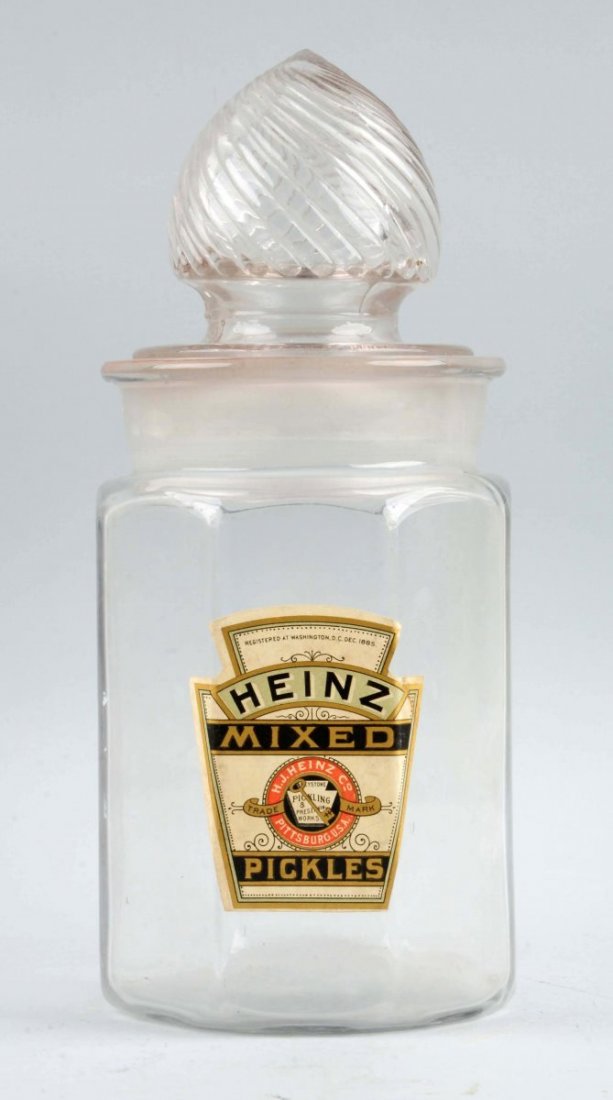 Early Heinz Mixed Pickles Canister With Lid.: A few small chips and stress chips on the ground glass lid at base. Condition (Excellent). Size 12 - 1/2" T.