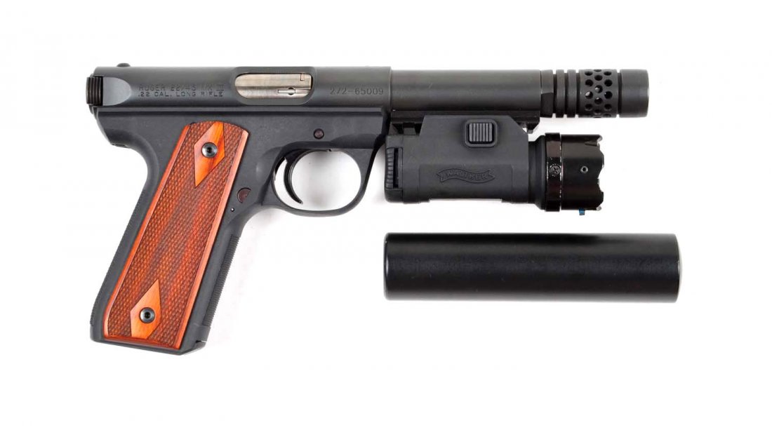 **Near New Ruger Mark III Target Pistol.: Serial # 272-65009 .22 LR caliber with a 5-1/2" barrel. This is a near new Ruger heavy barrel target semi-automatic pistol with blued finish and checkered wood grips retaining all of the original fini