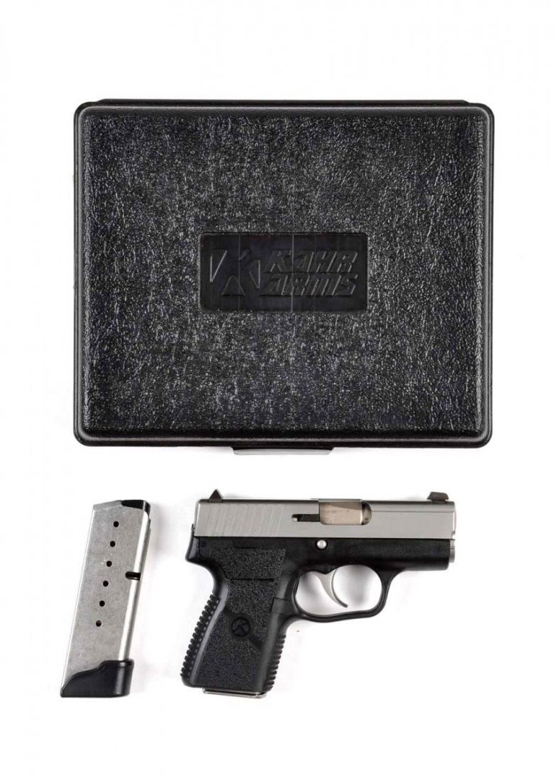 **Boxed Kahr Semi Automatic Pistol.: Serial # VB9087 Serial number is VB9087, caliber is 9x19, barrel length is 2-3/8". Offered as near new in the original box with all paper work and two magazines. The model PM9 it is a light weight dou