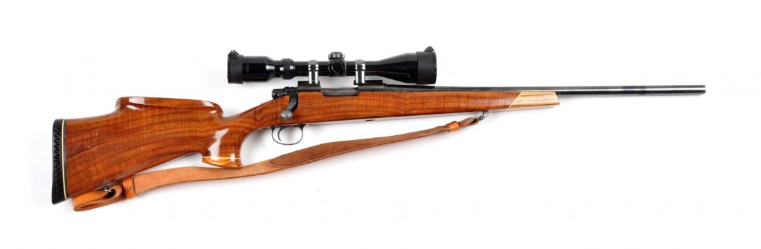 **Custom Remington Model 700 Bolt Action Rifle.: Serial # 6603024 .243 Winchester caliber with a 22" barrel. Standard Remington barreled action, front and rear sights removed. Bolt is jeweled. Bolt knob is checkered. A Tasco 4x10 scope installed. A 