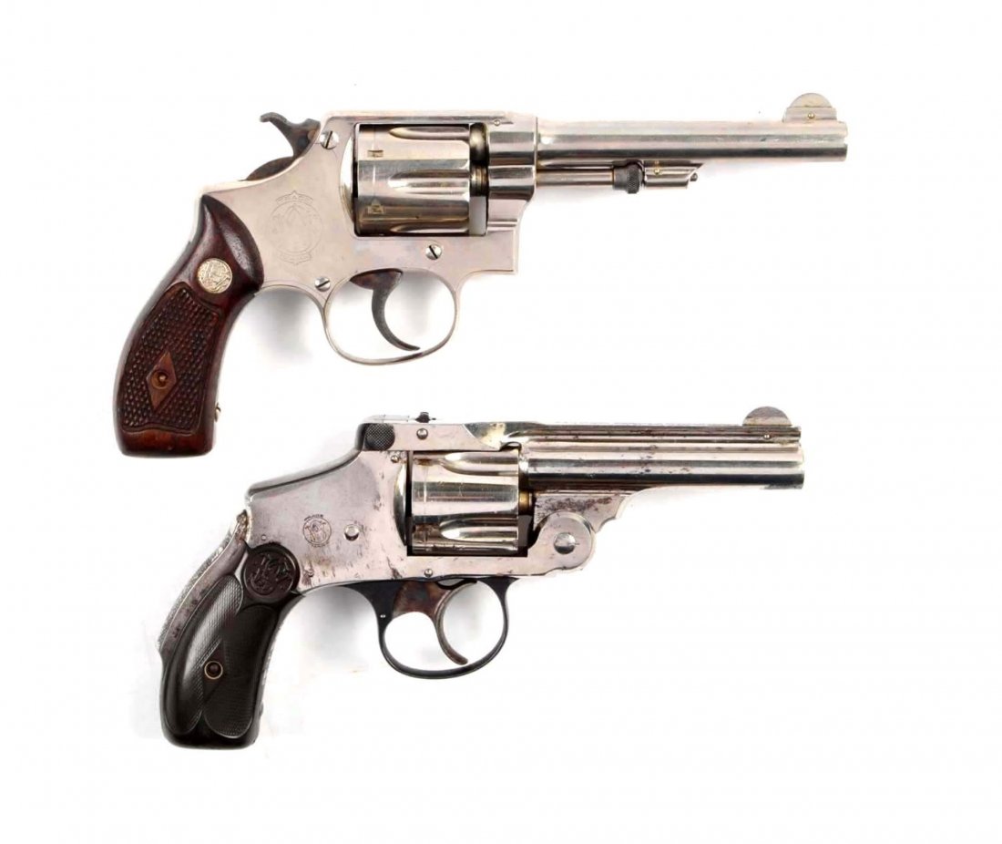 **Lot Of 2: Early S&W Handguns.: Serial # 3022 & 170076 The first gun is a .38 safety hammerless, double action revolver in .38 Smith & Wesson caliber with a 3-1/4" barrel. This is considered a standard Fourth Model manufactured from