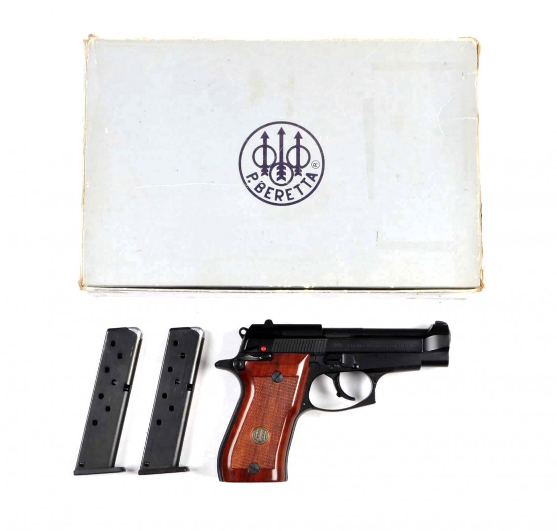 **Boxed Beretta Model 85 F-W Semi-Auto Pistol.: Serial # F05407Y .380 ACP with a 3-3/4" barrel. Standard features include matte blue finish, checkered walnut grips, white dot combat sights, double action, semi-automatic. Gun show as new inside and 