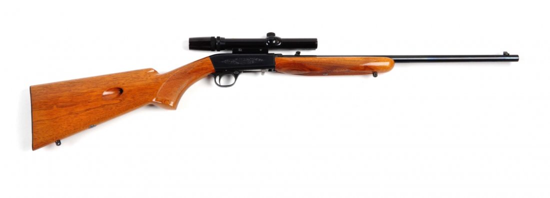 **Browning 22 Caliber Semi-Automatic Rifle.: Serial # 5605569 .22 LR caliber with a 19" barrel. This was manufactured in Belgium. It is a semi-automatic .22 rifle with checkered walnut stock, takedown and blued finish. Gun remains in near new co