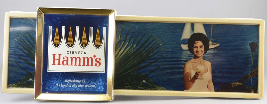 Hamm's Beer Lighted Sign: This illuminated Hamm's beer sign reads, "Cerveza Hamm's, as refreshing as the land of sky blue waters." Condition (Excellent). Size 40-1/2" x 14"