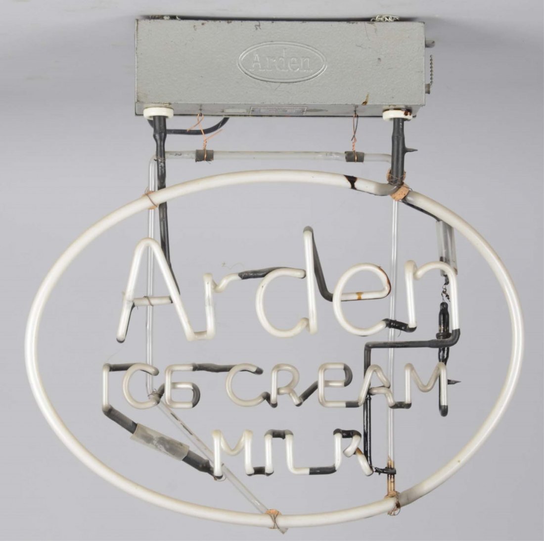 Arden Ice Cream Milk Neon Advertising Sign: Electric sign on glass tube frame hanging from a built-in transformer. Works. Circa 1950s. Condition (Very Good). Size 23" x 4" x 23"