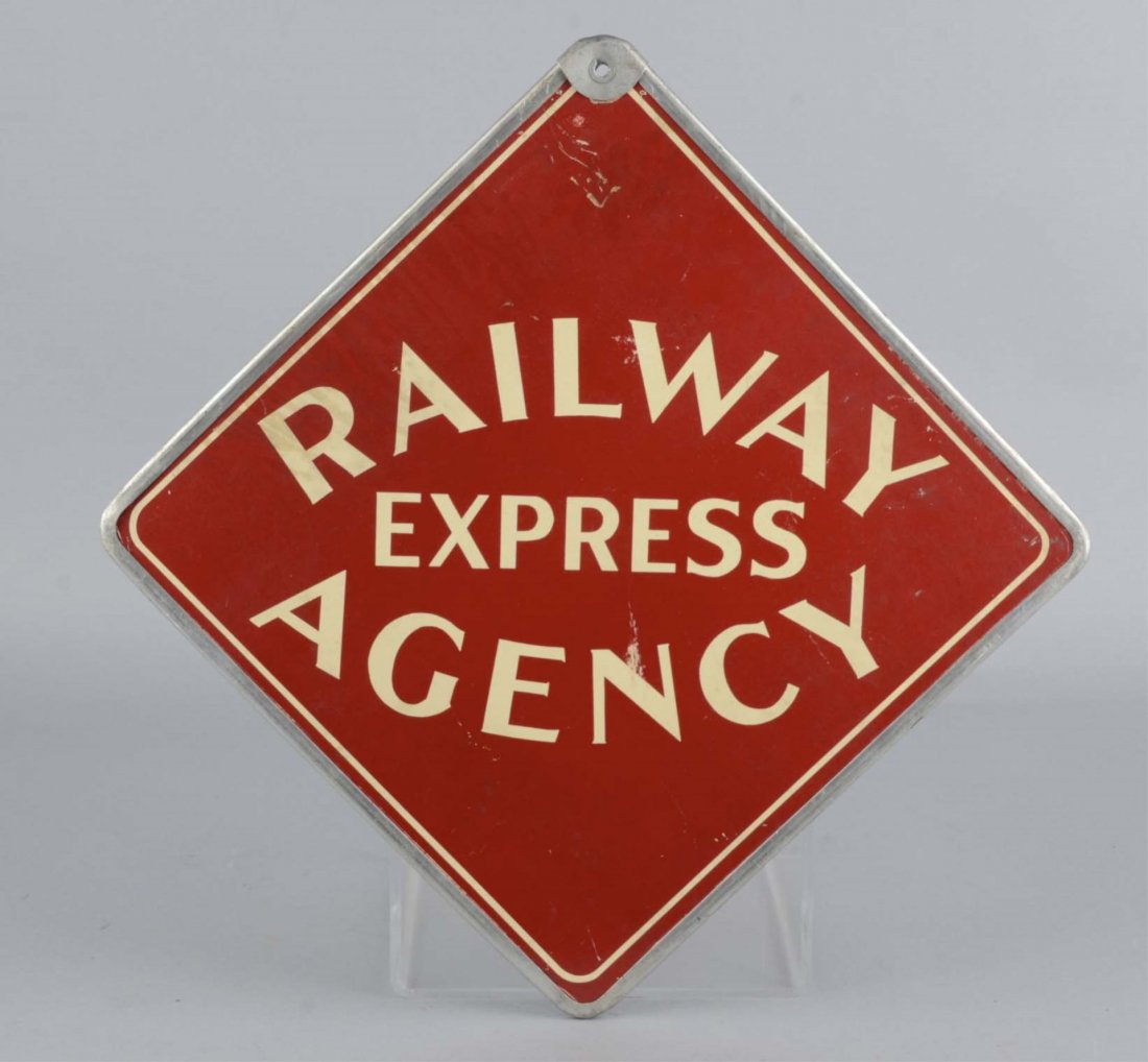 Railway Express Agency Pressboard Sign: This double sided sign is surrounded by a metal frame. Condition (Excellent). Size 14" x 14"