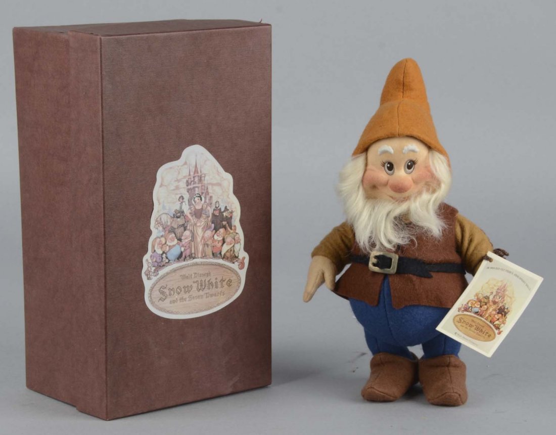 R. John Wright Snow White Happy Doll: Collectible doll of Happy the Dwarf from Walt Disney's Snow White And The Seven Dwarves in original box. No. 2046 of 2500. Condition (Near Mint Plus). Size 11-1/4" x 4-1/4" x 6-1/4"