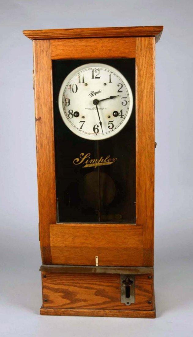 Early Simplex Oak Time Clock Style T-10: Serial No. 8638 by Simplex Time Recorder Co. Gardner, Mass. Condition (Very Good). Size 31" x 12-1/2" x 7-1/2"