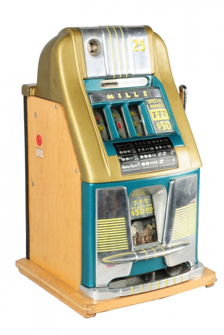 25 Mills "777" High Top Slot Machine: This slot machine is in original condition. It is not playing at present and will need service since all of the old grease is hardened. Includes keys. Circa 1949. Condition (Very Good). Size 26-1/2''