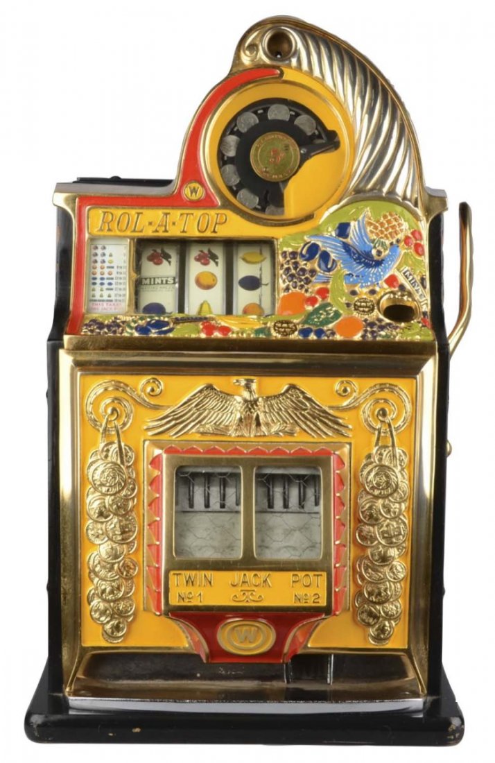 5 Watling Rol A Top Bird of Paradise Slot Machine: This twin jackpot model slot machine, is an older restoration. The castings have been gold plated. Includes keys. Circa 1935. Condition (Excellent). Size 17" x 16" x 27"