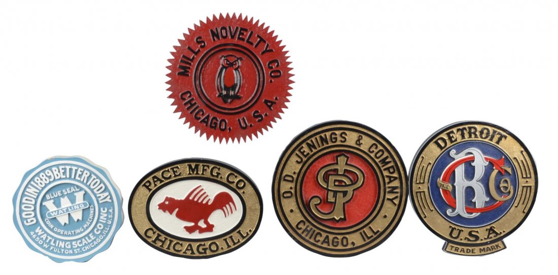 Lot Of 5: Slot Machine Manufacturer Logo Signs: Including 1 - Mills Novelty Co., 1 - Caille Brothers, 1 - O.D. Jennings & Co., 1 - Pace Mfg. Co., and 1 - Watling Scale Co. Inc. Each made from wood and painted. Condition (Excellent). Size Largest: 1