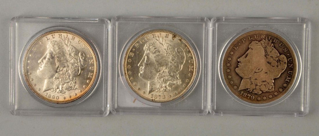 Lot Of 3: Morgan Silver Dollars in Cases. (1 of 2)