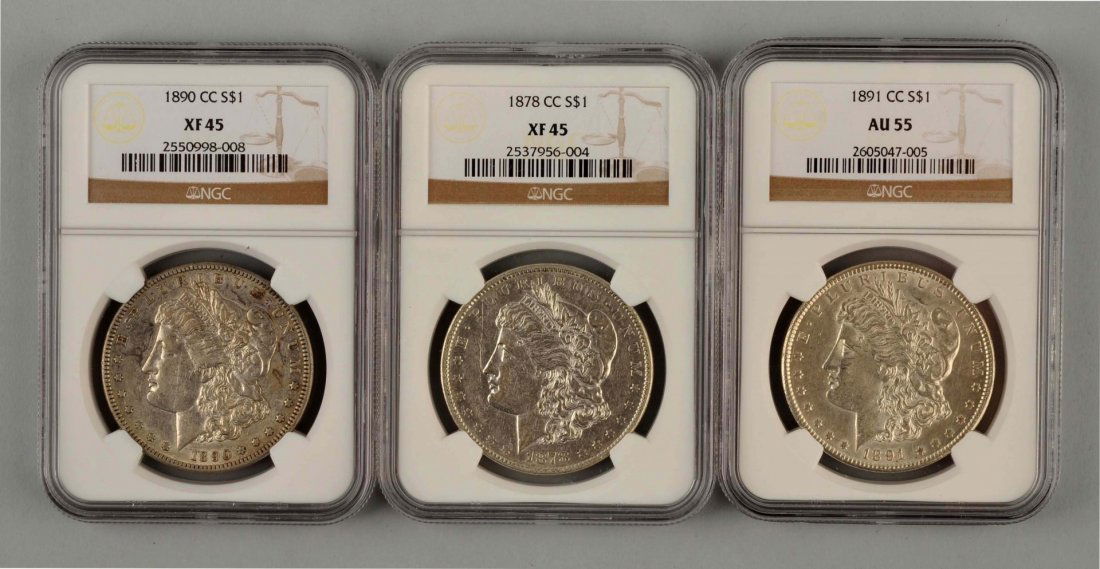 Lot Of 3: Morgan Silver Dollars in Cases. (1 of 2)