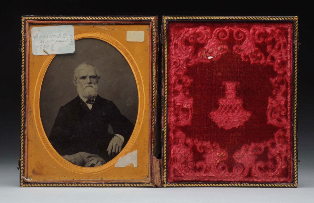 1/2 Plate Tin Type by Collins Phila, Pa.: Great picture of a man sitting down. The top of the case has split from the bottom. Condition (Good). Size 7'' T.