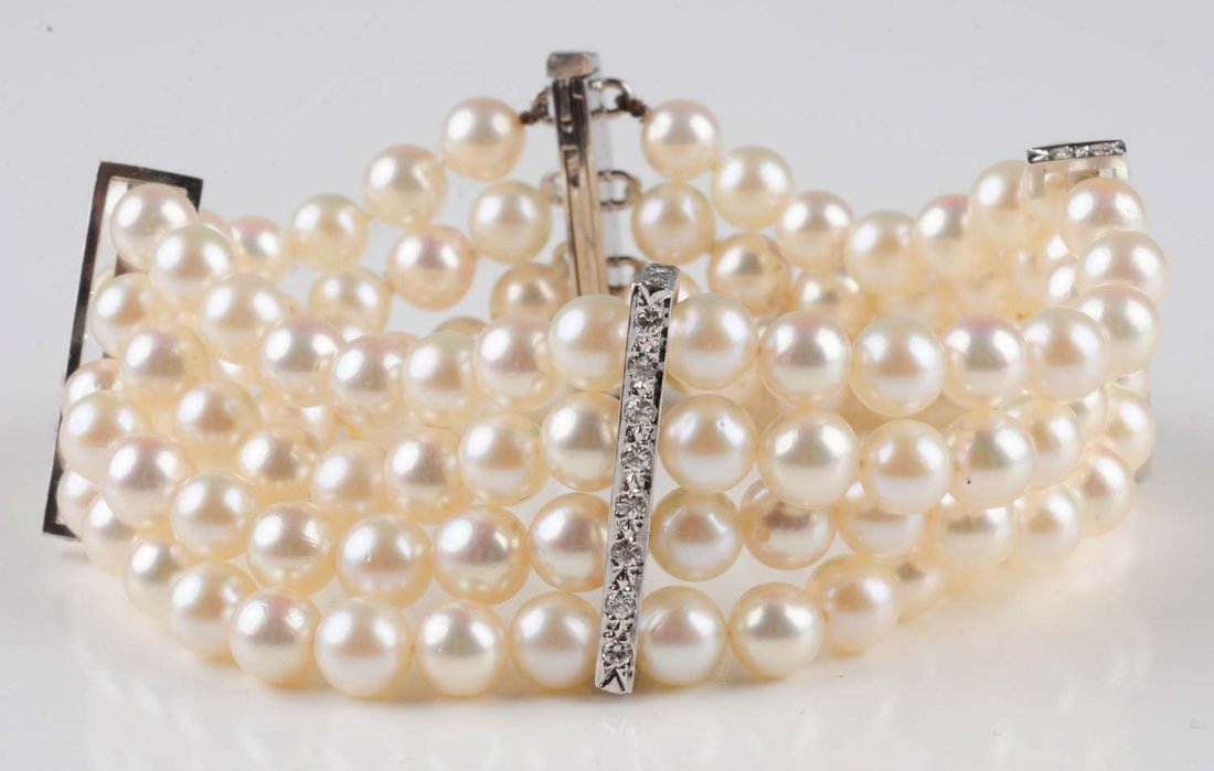 Pearl & Diamond Bracelet.: Constructed from four strands of 6mm pearls supported by 14K white gold bars set with full cut diamonds, 48 count, approximately 1.20 ct total diamond weight, 7.25" length. Condition (Very Good). Size