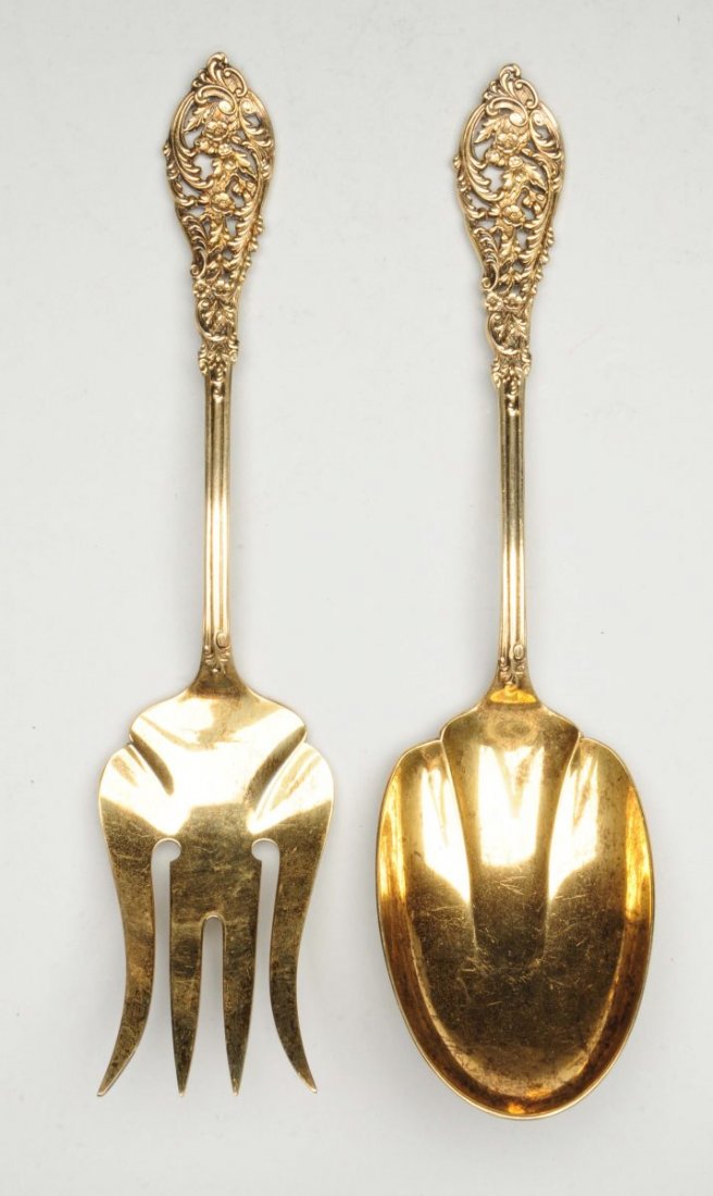 Pair of Reed & Barton Sterling Salad Servers.: Florentine Lace pattern, gilt, with pierced foliate handles. length: 9". Weight: 6.2 ozt web conditions: - minor signs of use and wear - gilding in good condition
