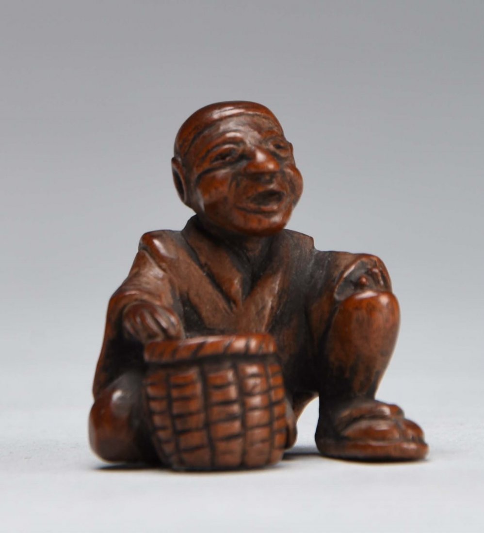 Early Japanese Wood Netsuke of a Man Sitting. (1 of 2)