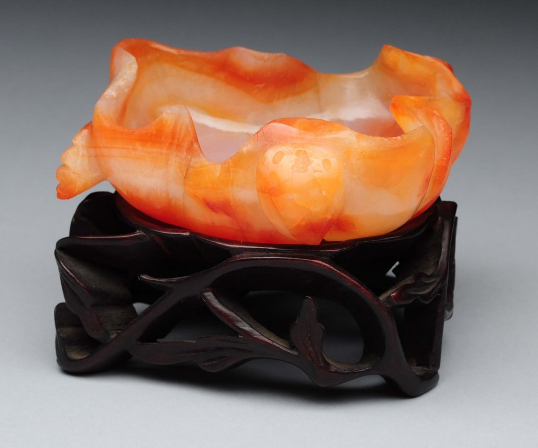 Chinese Carved Carnelian Dish on Stand.: This beautiful carved carnelian dish rests on a vintage wooden stand. Condition (Excellent). Size 3'' L.