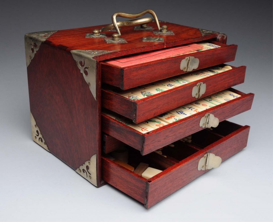Antique Chinese Bone Mahjong Set.: In a tiered wooden box with brass hardware. Has a "Made in China" label on back. Great shape with minor warping to a couple of drawers. Condition (Excellent - Near Mint). Size Box : 6 -1/2" T.