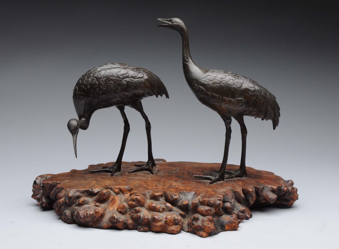 Japanese Bronze Emus on Burl Wood Base.: Well done image of emu pair. Mounted on burl wood base. Great shape with a minor repair on the front left leg of tall emu. Condition (Excellent). Size 13-1/4'' L.