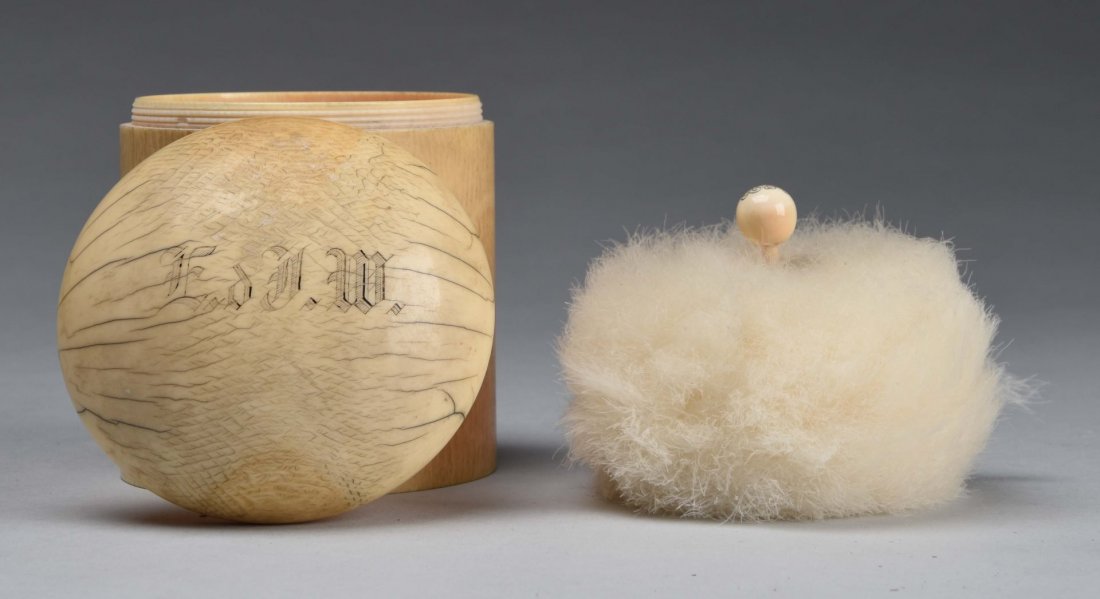 Early Ivory Powder Box.: Has a screw off top with a monogram on top. The puff has a monogrammed topper as well. Well made with light wear and stress cracks to the top. Condition (Very Good). Size 5'' T.