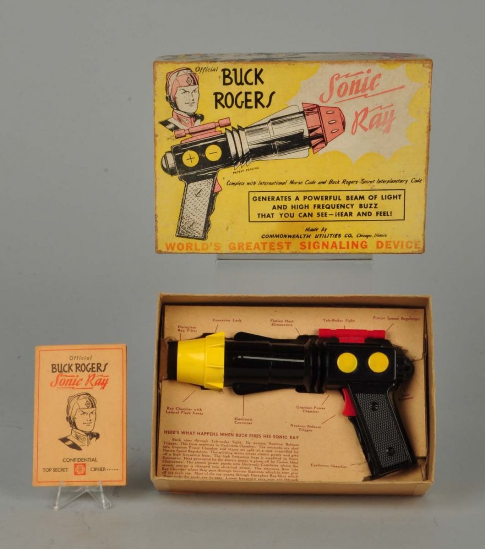 Buck Rogers Sonic Ray Gun In Box.: This gun is in working condition and includes a cipher booklet and original box. The box has moderate wear. Condition (Very Good Plus). Size 8 - 1/2" L. x 6" T. x 2" W.