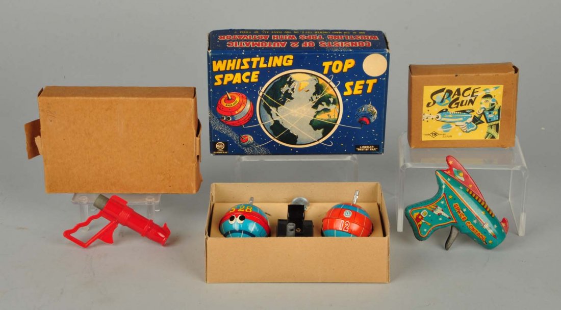 Lot Of 3: Space Guns & Whistling Space Top Set.: This lot includes a plastic space gun with a box, a sparking gun with a box and a whistling space top set with a box. Minor wear to boxes. Condition (Excellent). Size Largest: 4 - 1/2" T. x 7" L. x 2"
